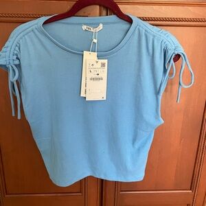 Zara light blue short sleeve top… Women’s size Large. NWT